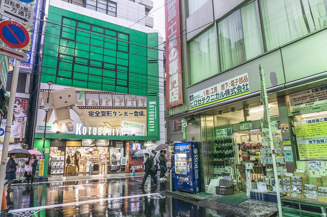 A hobby-shop storefront in Akihabara, Tokyo's collector-goods district (illustrative — not AmiAmi or HLJ's own storefront)