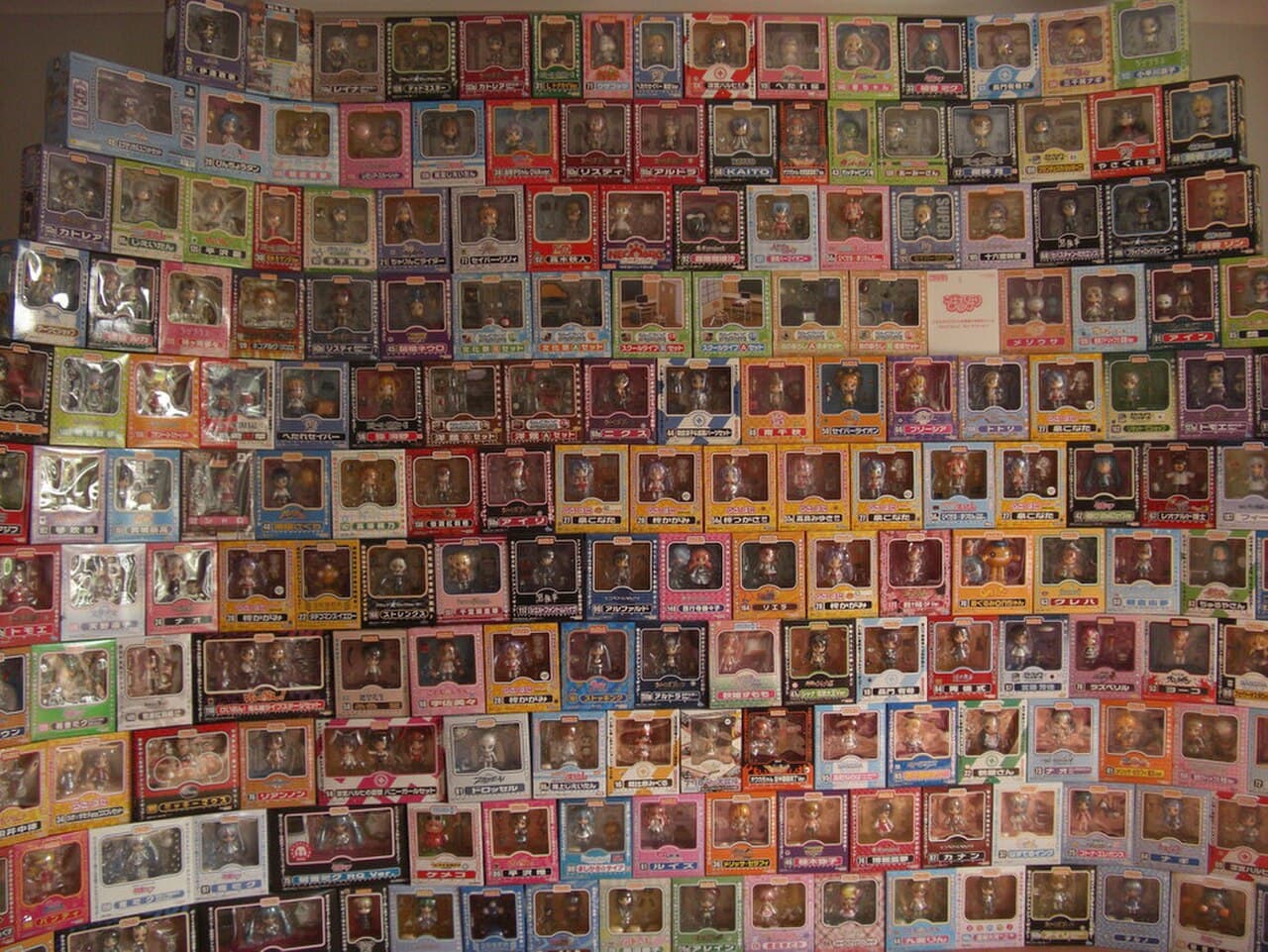 A shelf of genuine, boxed Nendoroid figures — the official branding, box print quality and consistent paint work shown here are what collectors compare suspect items against