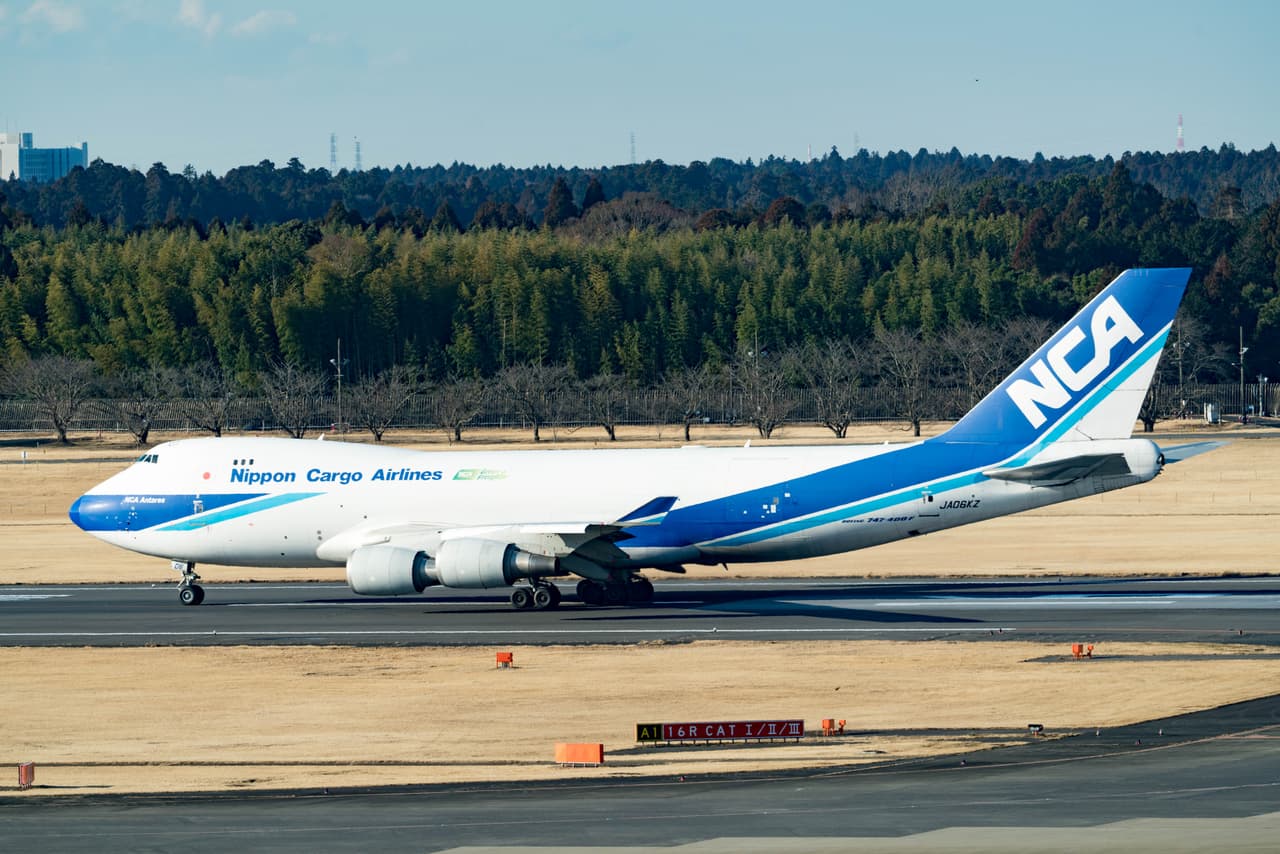 A Nippon Cargo Airlines freighter at Tokyo Narita Airport — the kind of air freight that carries proxy and retailer parcels from Japan to overseas collectors, now subject to US duty on arrival regardless of value